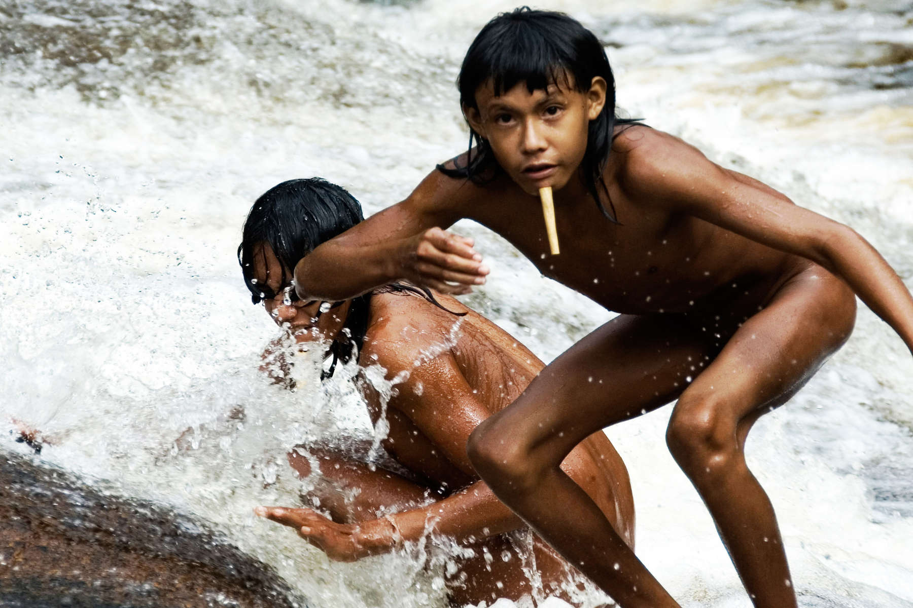 Zoe children playing in a waterfall